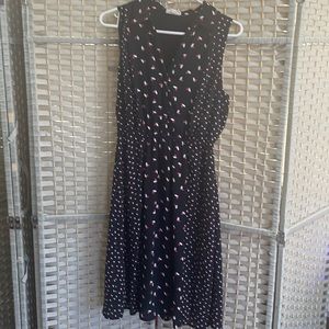 Black with cute heart design. Nice cool sundress. Knee length. Very comfy.